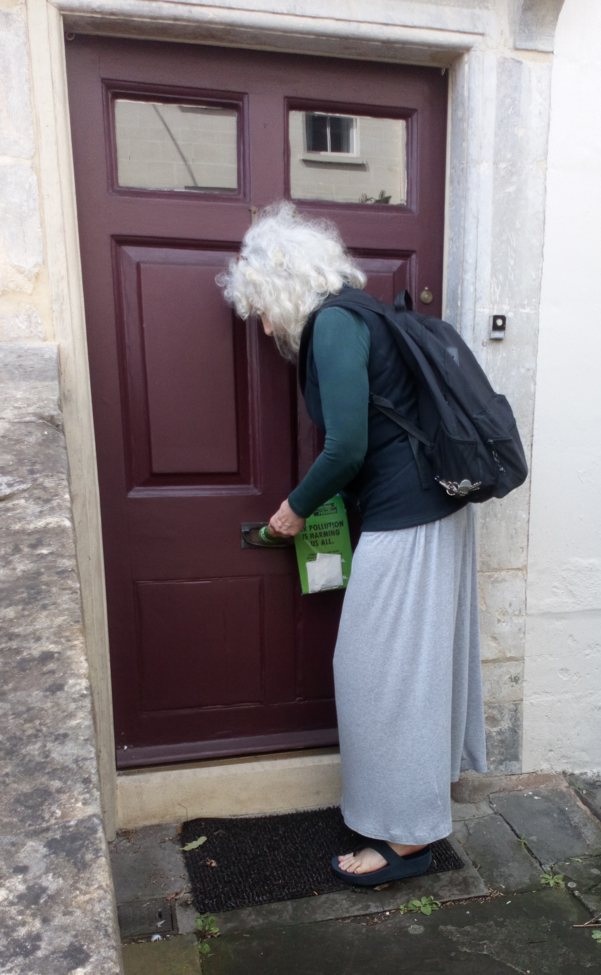 Lady Bag delivers a leaflet for Bath's Extinction Rebellion. 10 August 2019